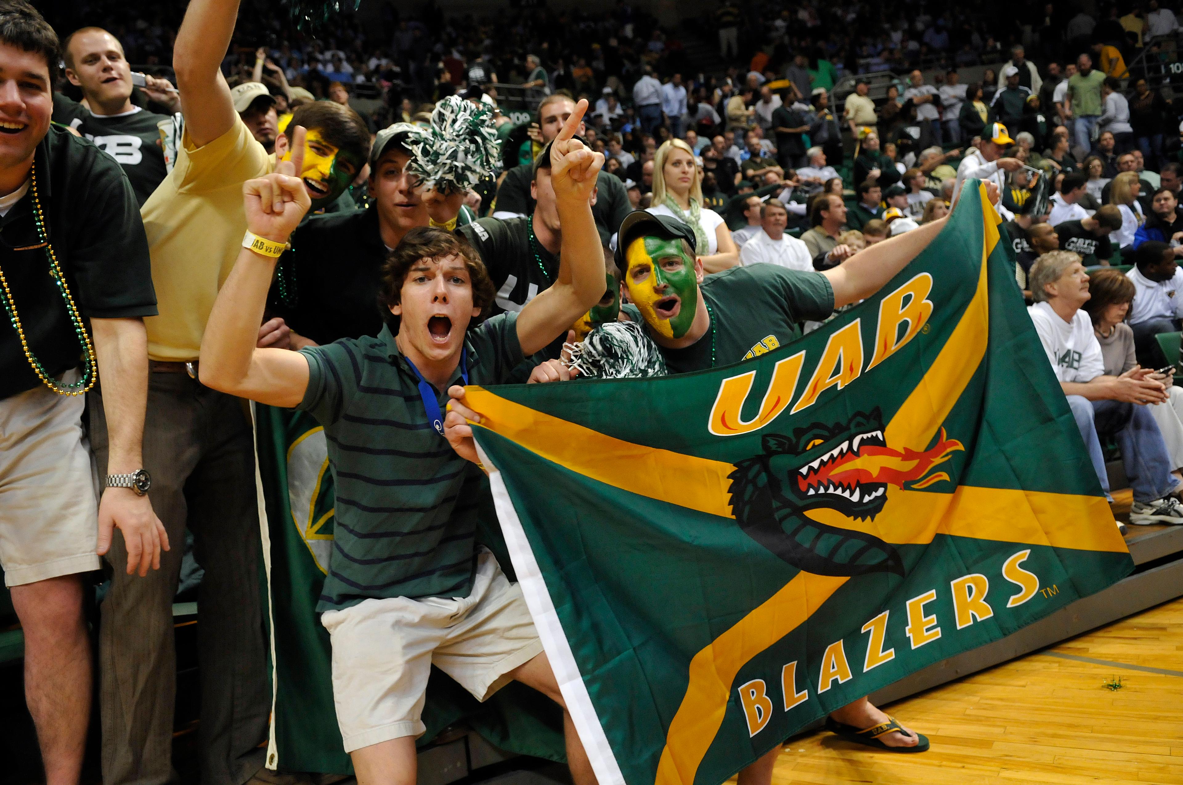 INTO UAB cheering crowd at a school event showing school flag_28388.jpg